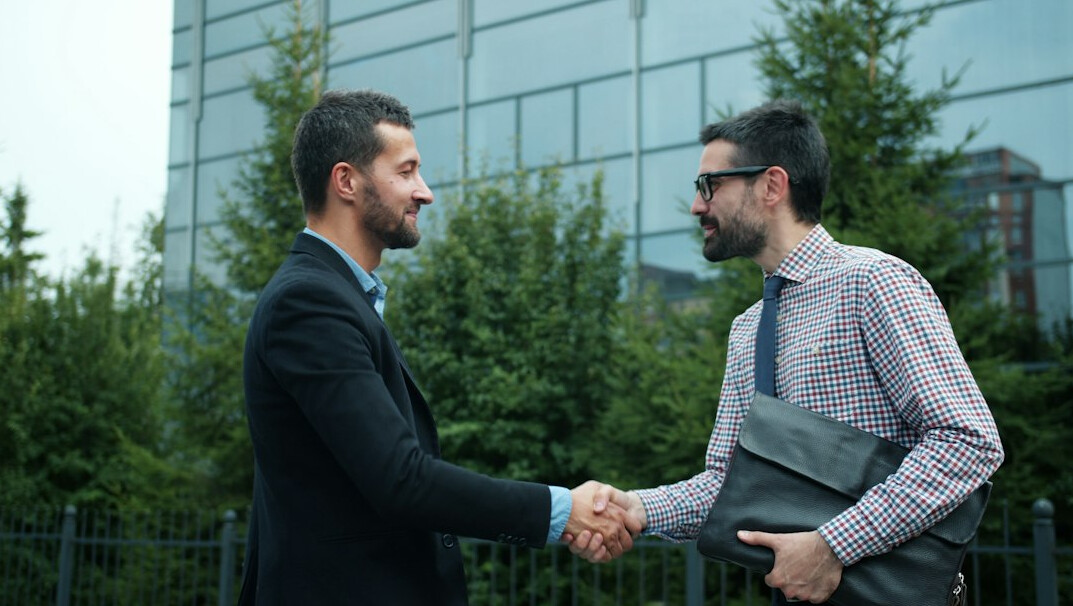 happy client shaking hands